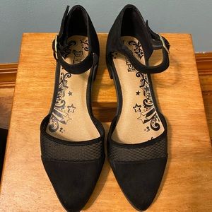 Pointy black flats with ankle strap, gold buckle, see through netting design